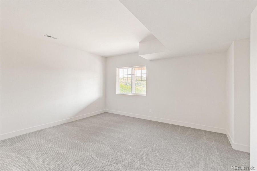 Spacious, unfurnished interior of a new home in Terrain Oak Valley, Castle Rock (Image 17).