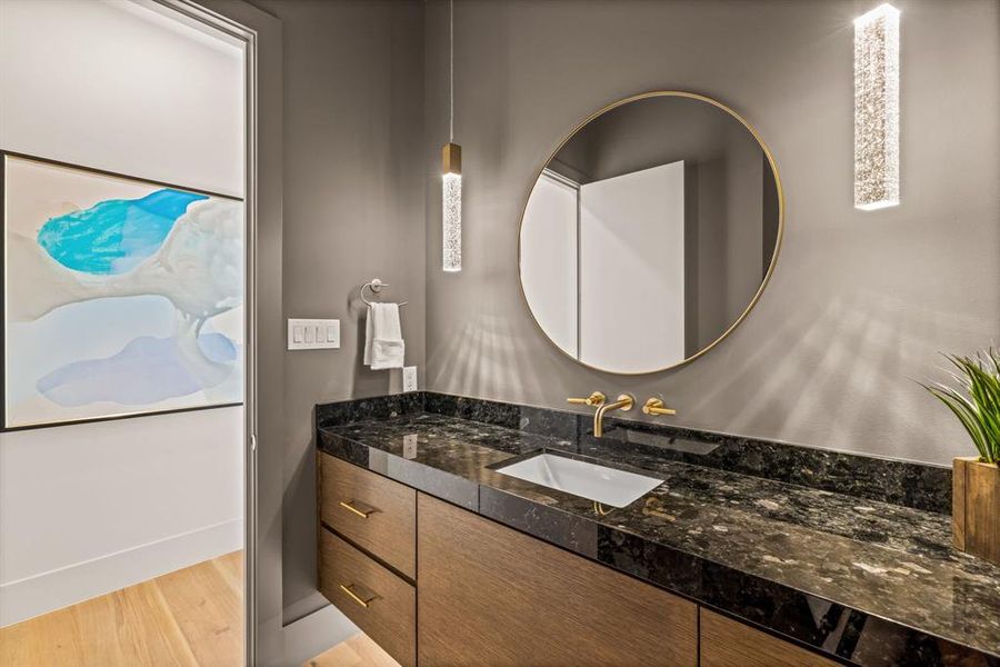 Bathroom with vanity and wood finished floors Bathroom with vanity and wood finished floors