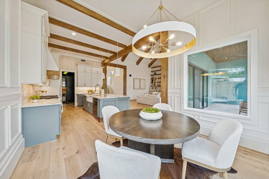 The lighting in this house is very curated offering a bit of glam where needed. This dining room could accommodate a much larger table.