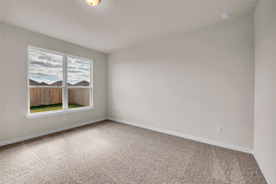 Unfurnished room featuring carpet floors and baseboards