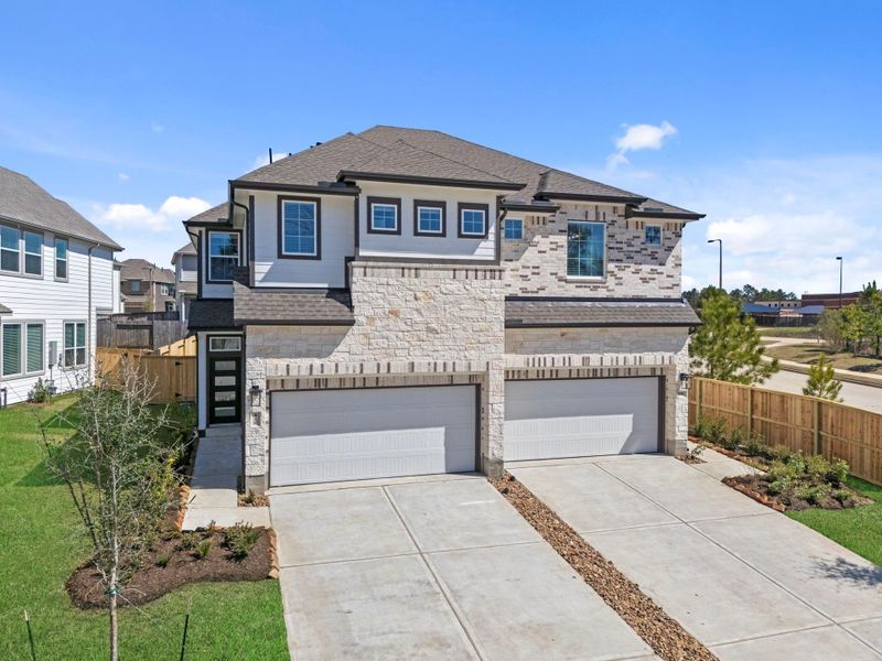 Front exterior of a new home in Woodforest, Montgomery, TX, highlighting curb appeal (Image 17).