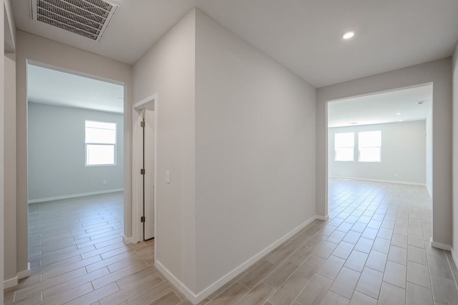 A long hallway with white walls.