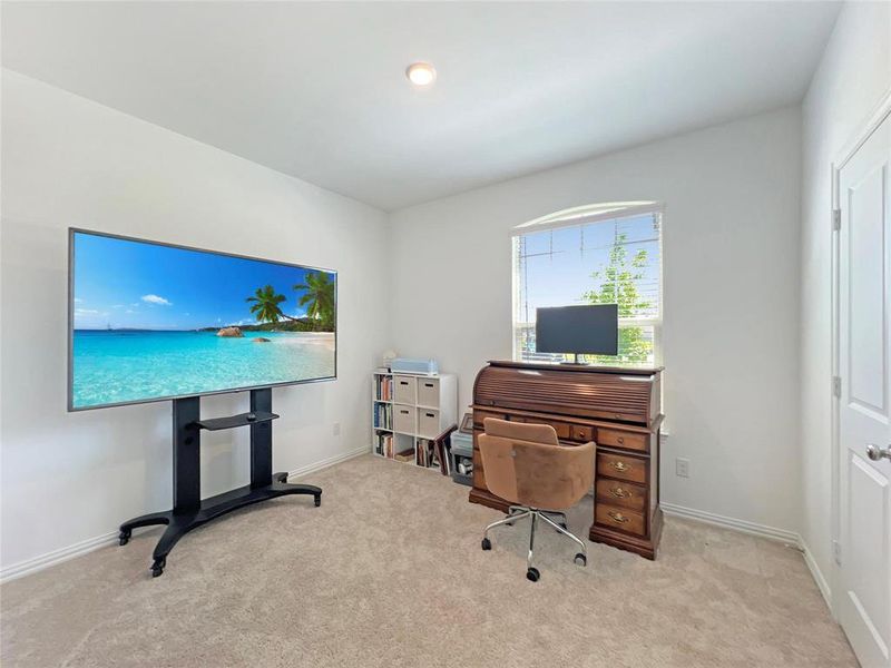 Office area featuring light colored carpet