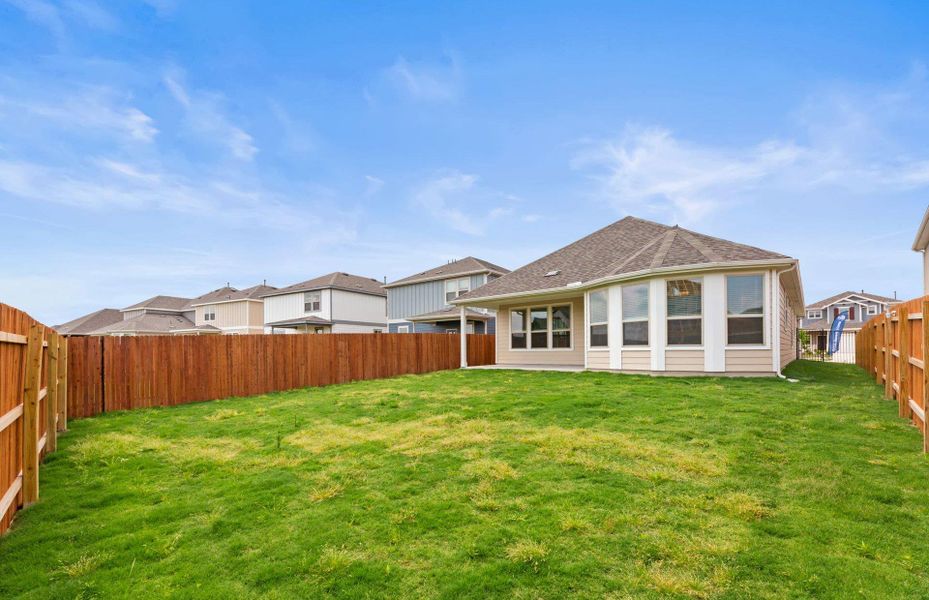 Front exterior of a new home in Santa Rita Ranch, Liberty Hill, TX, highlighting curb appeal (Image 21).
