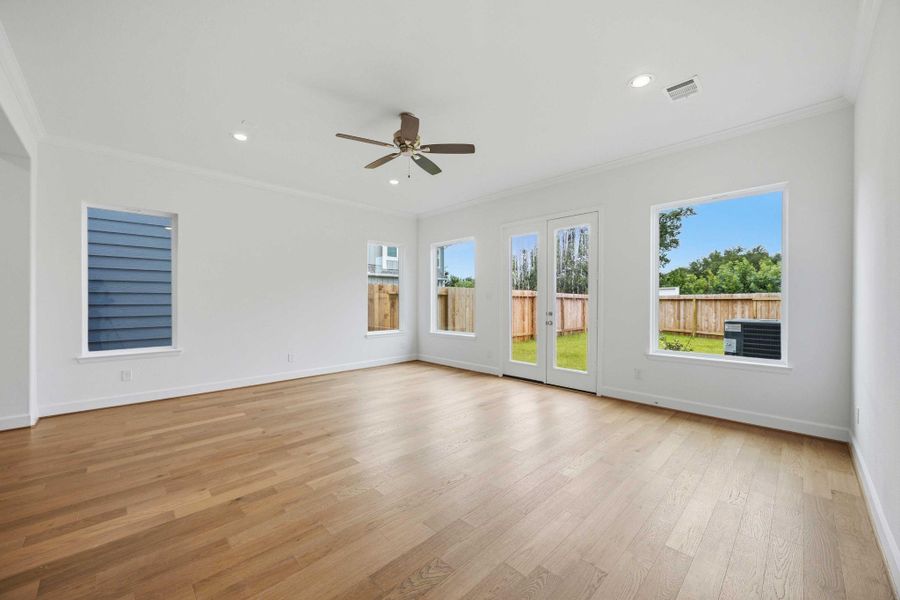 At the heart of the home, this vast living room offers endless possibilities for relaxation and entertaining.