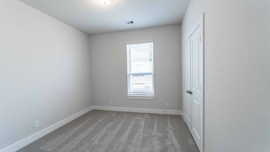 Spacious, unfurnished interior of a new home in Sunterra, Katy (Image 24).