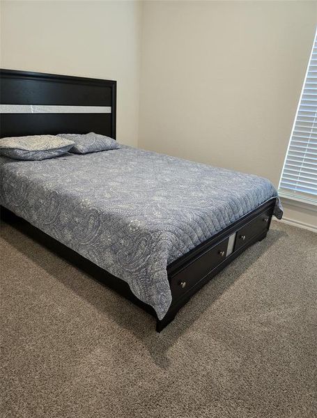 Bedroom featuring carpet flooring