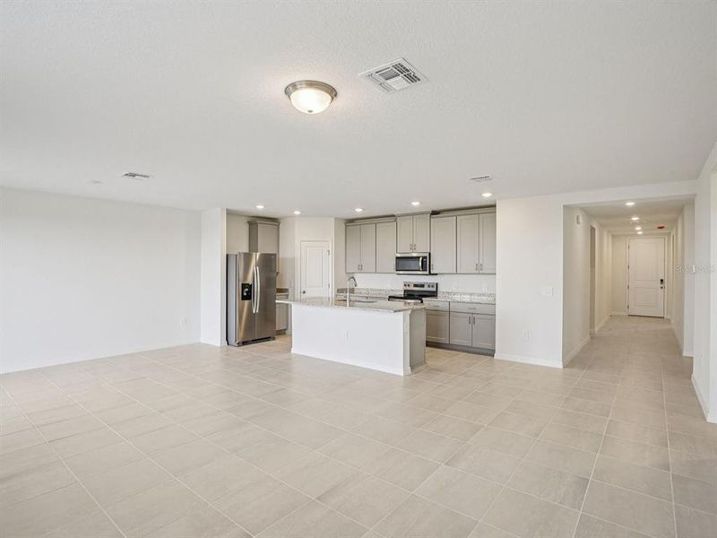 Spacious, unfurnished interior of a new home in The Reserve at Hammock Oaks - Signature Series, Lady Lake (Image 6).