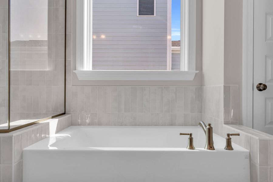 Representative furnished interior of a home built from the The Bradley by RobuckHomes in Windwater, Hampstead (Image 55).