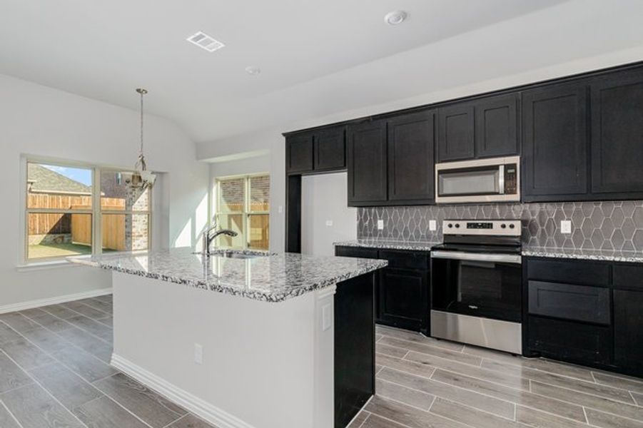 Furnished interior view inside a new home in Mustang Place II, Heartland (Image 5).
