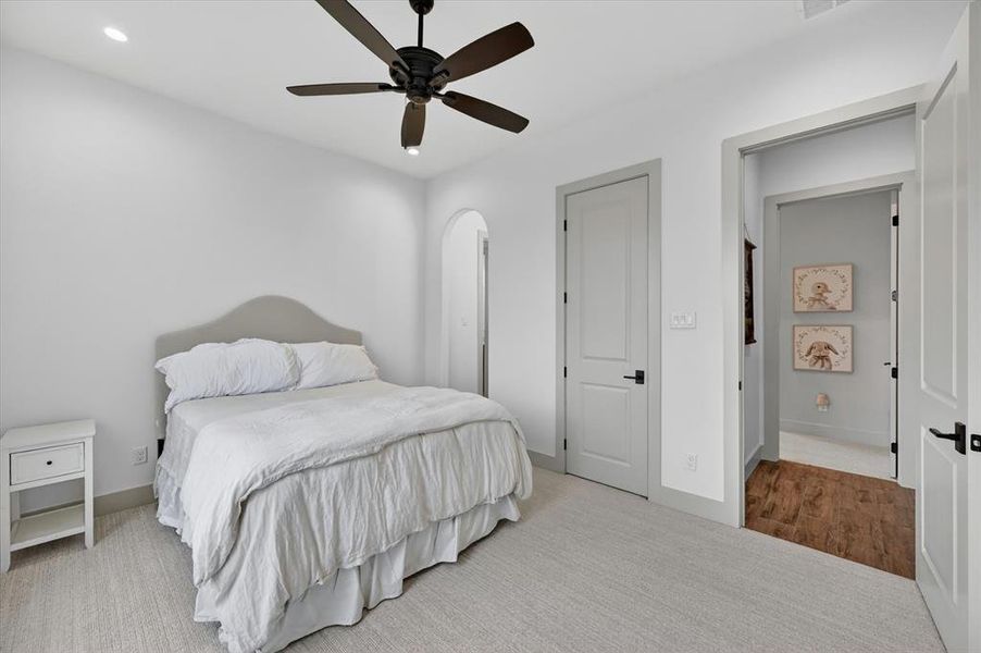 Carpeted room with recessed lighting and a ceiling fan