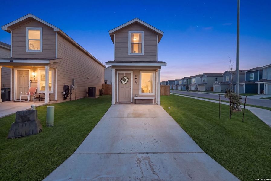 Front exterior of a new home in Flora Meadows, Converse, TX, highlighting curb appeal (Image 2). Front exterior of a new home in Flora Meadows, Converse, TX, highlighting curb appeal (Image 2).