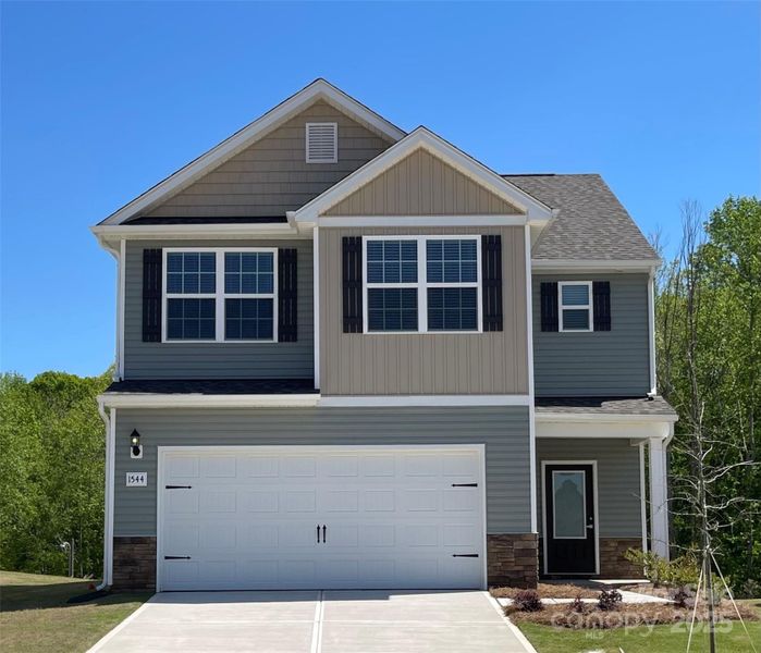 Front exterior of a new home in Knights Bridge, Richburg, SC, highlighting curb appeal (Image 1).