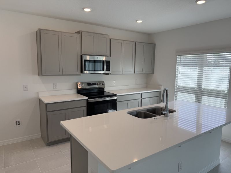 Furnished interior view inside a new home in Trinity Gardens, Deland (Image 3).