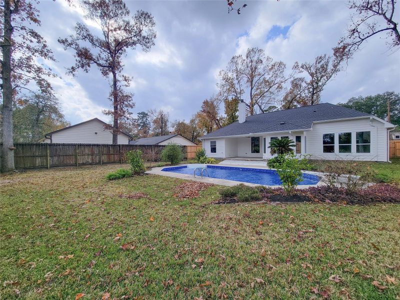 Exterior details and patio area of a home in , Conroe (Image 28).