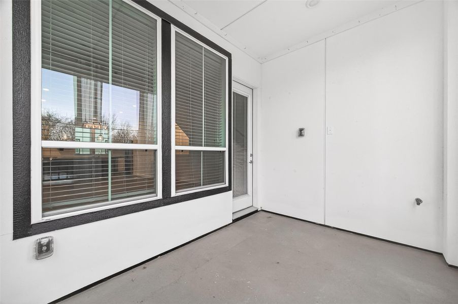Exterior details and patio area of a home in The Corner At Buffalo Pointe, Houston (Image 26).