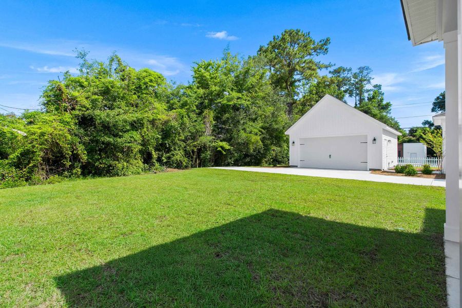 Exterior details and patio area of a home in Downtown Loris Homes, Loris (Image 27).