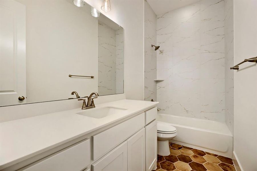 Bathroom featuring vanity and shower / tub combination