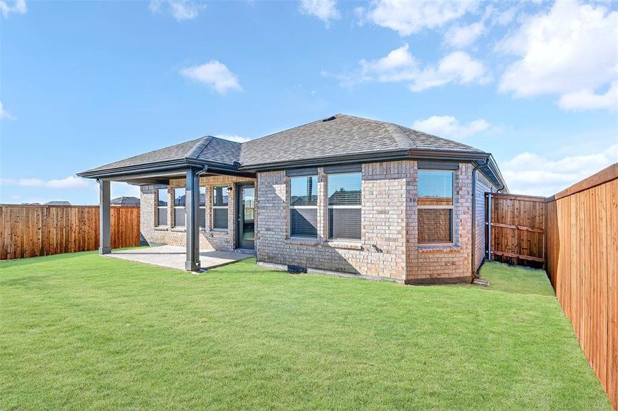 Exterior details and patio area of a home in Mobberly Farms, Pilot Point (Image 3). Exterior details and patio area of a home in Mobberly Farms, Pilot Point (Image 3).