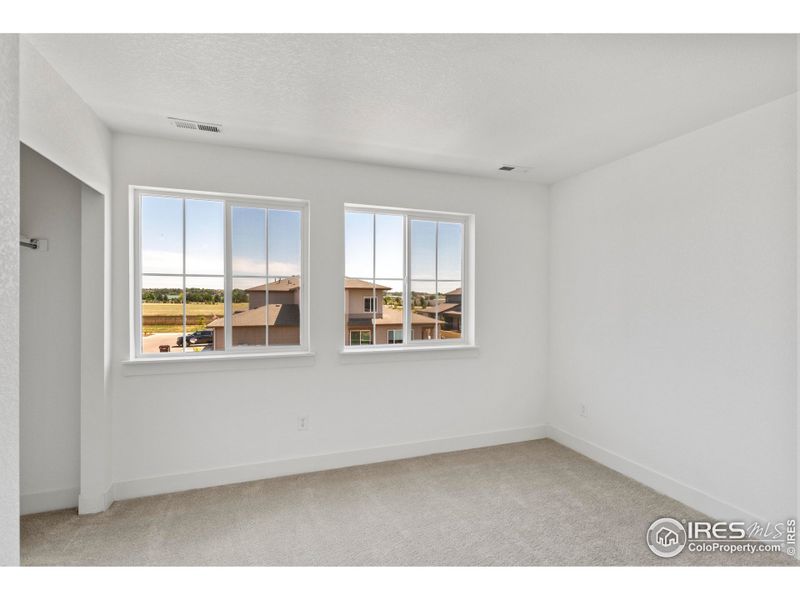 Spacious, unfurnished interior of a new home in Trailside on Harmony, Timnath (Image 9).