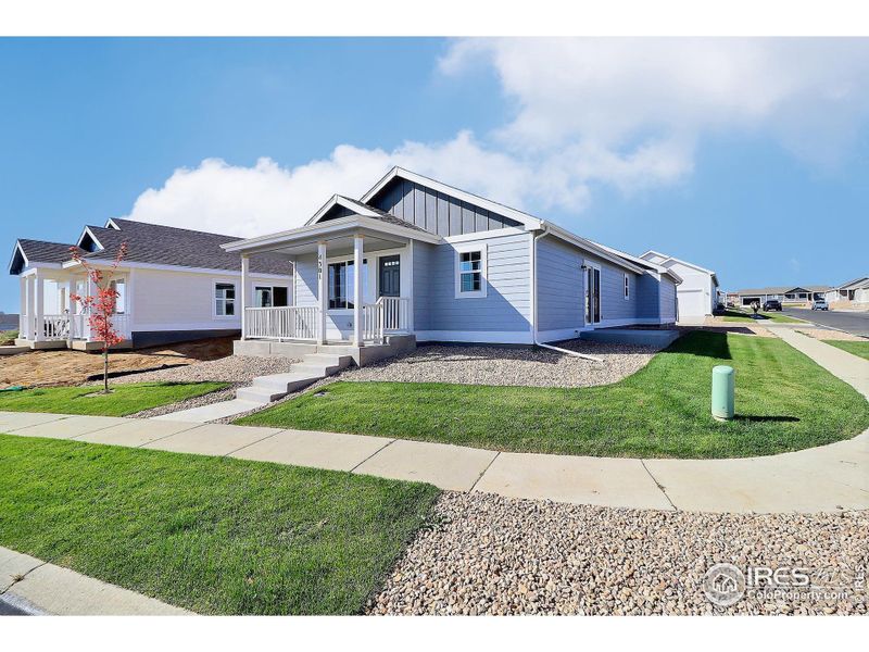 Front exterior of a new home in , Evans, CO, highlighting curb appeal (Image 1). Front exterior of a new home in , Evans, CO, highlighting curb appeal (Image 1).