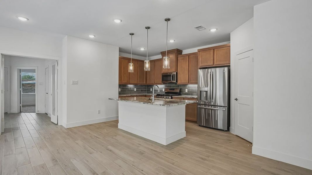 Furnished interior view inside a new home in Meridiana Townhomes, Iowa Colony (Image 5).