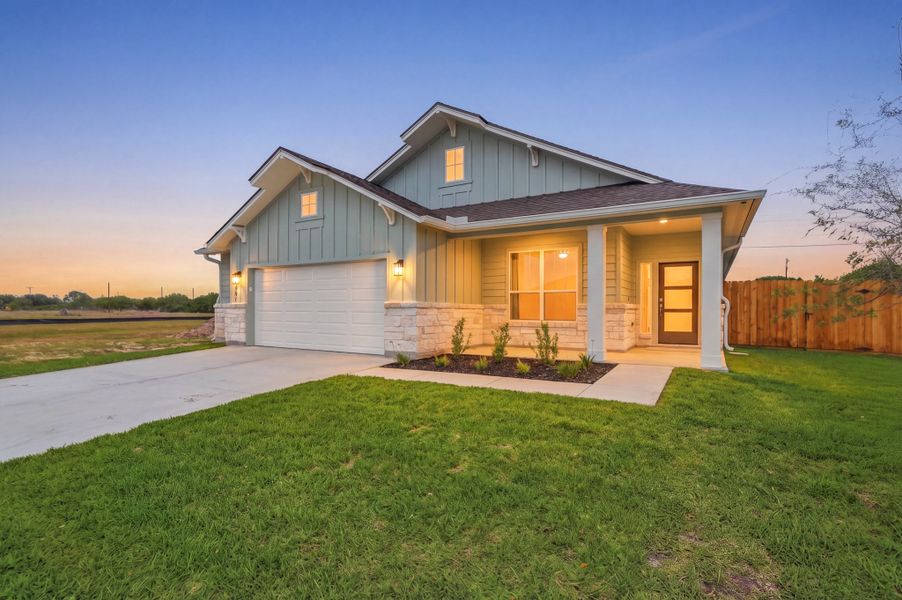 Front exterior of a new home in TerraVista, Victoria, TX, highlighting curb appeal (Image 2). Front exterior of a new home in TerraVista, Victoria, TX, highlighting curb appeal (Image 2).