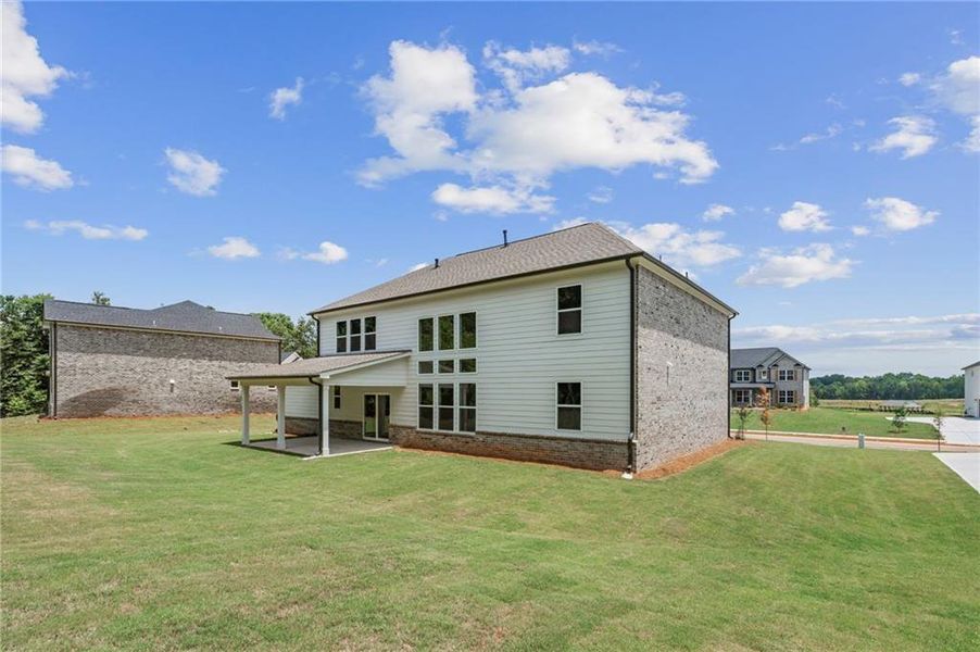 Exterior details and patio area of a home in Windsong Estates, McDonough (Image 4).