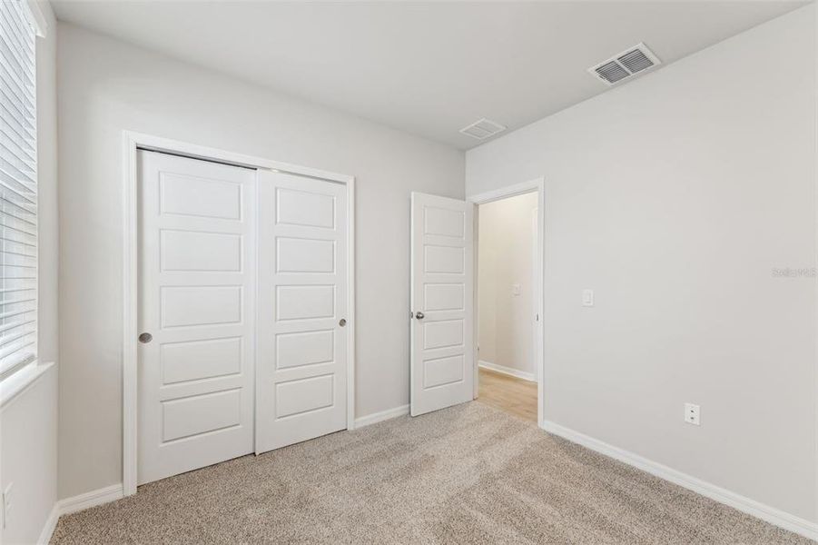 Spacious, unfurnished interior of a new home in Crescent Lakes - Premier Series, Punta Gorda (Image 16).