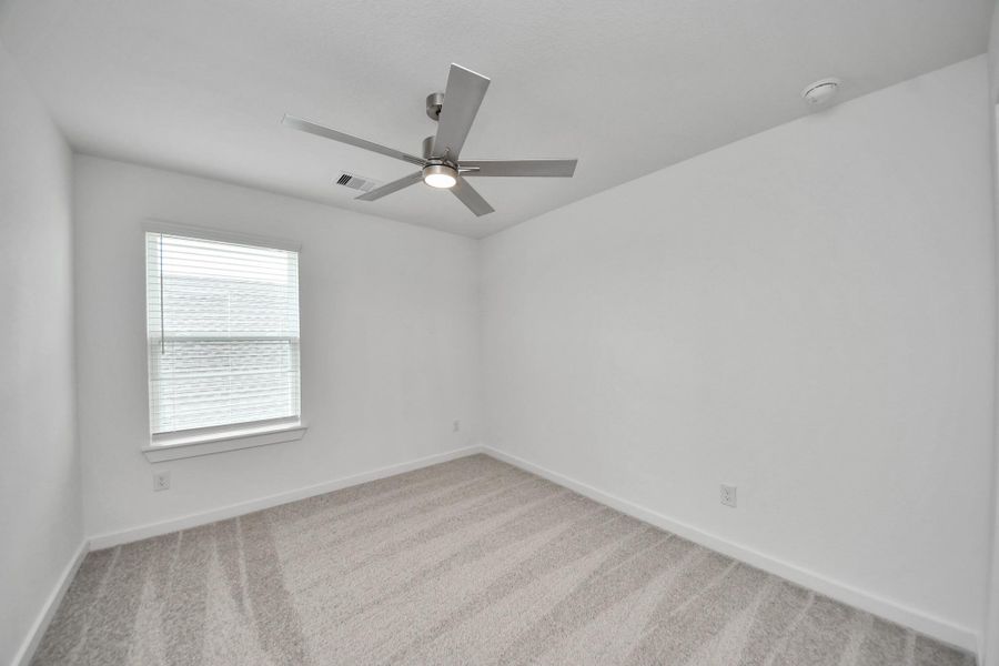 Secondary bedroom features plush carpeting, large windows that let in plenty of natural light, bright paint, and spacious closets. Secondary bedroom features plush carpeting, large windows that let in plenty of natural light, bright paint, and spacious closets.