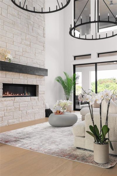 A breathtaking 20-foot tall limestone fireplace with an electric insert commands attention, serving as both a sophisticated centerpiece and a source of warmth for intimate gatherings