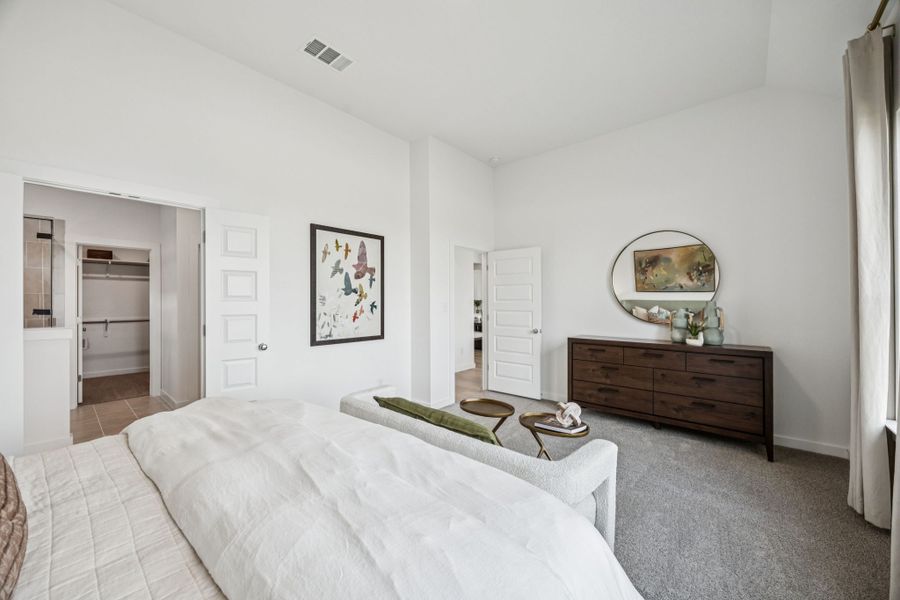 Primary Suite in the Trinity home plan by Trophy Signature Homes – REPRESENTATIVE PHOTO