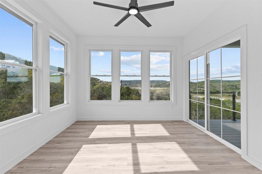 Unfurnished office featuring wood finished floors and baseboards