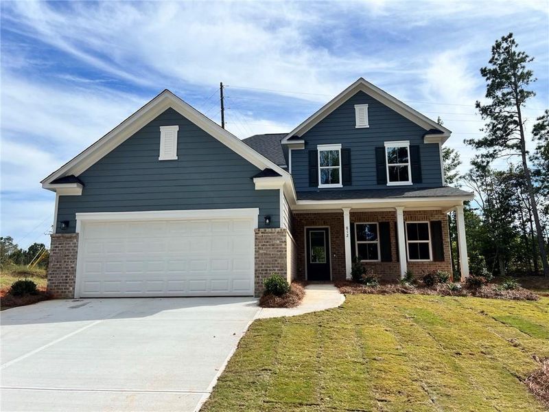 Front exterior of a new home in Watermist at Mirror Lake, Villa Rica, GA, highlighting curb appeal (Image 1). Front exterior of a new home in Watermist at Mirror Lake, Villa Rica, GA, highlighting curb appeal (Image 1).
