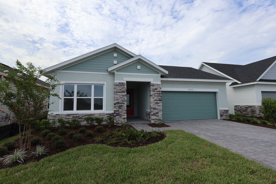 Front exterior of a new home in Lakeside at Satilla, St. Cloud, FL, highlighting curb appeal (Image 2). Front exterior of a new home in Lakeside at Satilla, St. Cloud, FL, highlighting curb appeal (Image 2).