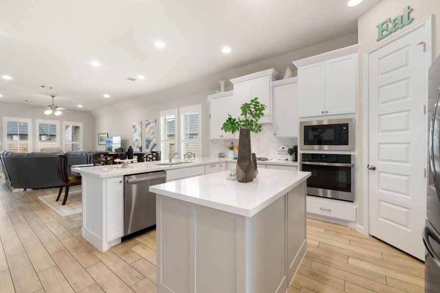 Elegant wood-look tile flooring & neutral tones throughout the main living areas.