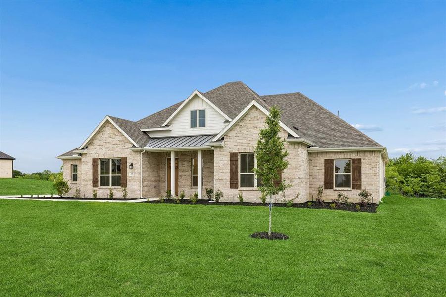 Front exterior of a new home in Ellis Ranch Estates, Waxahachie, TX, highlighting curb appeal (Image 2).