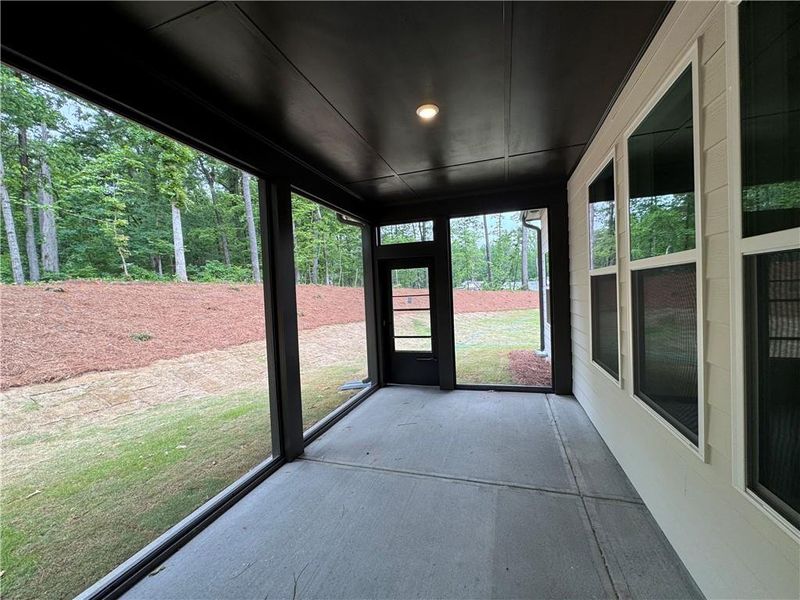 Exterior details and patio area of a home in Rosewood Lake Preserve, Hoschton (Image 25).