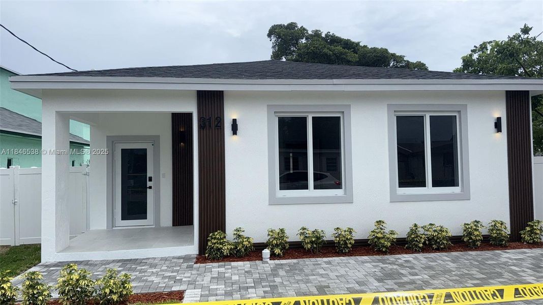 Front exterior of a new home in , Hallandale Beach, FL, highlighting curb appeal (Image 23). Front exterior of a new home in , Hallandale Beach, FL, highlighting curb appeal (Image 23).