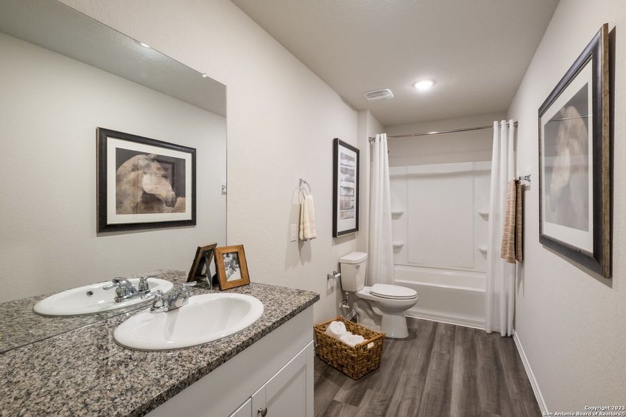 Furnished interior view inside a new home in Navarro Ranch: Cottage Collection, Seguin (Image 17). Furnished interior view inside a new home in Navarro Ranch: Cottage Collection, Seguin (Image 17).