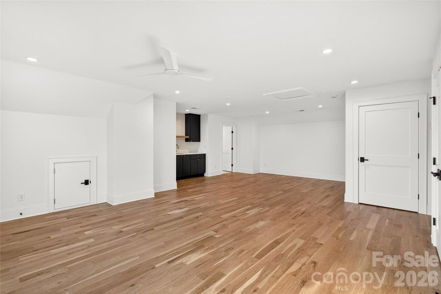 3rd Level. Bedroom/Loft. Built-in wet bar. Full Bath with shower beyond the wet bar.