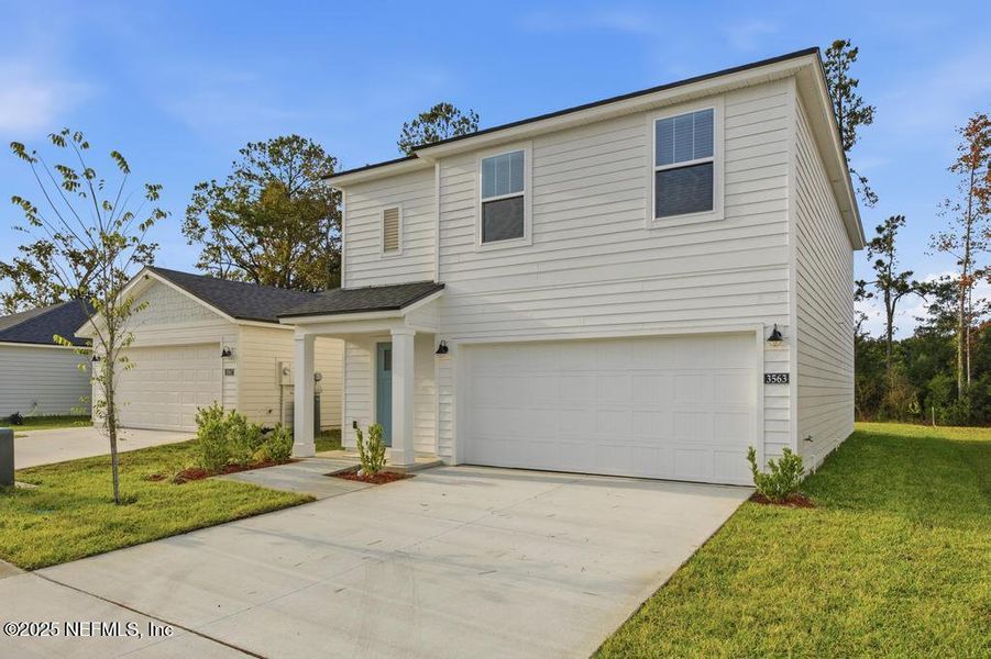 Front exterior of a new home in Kings Landing, Jacksonville, FL, highlighting curb appeal (Image 2). Front exterior of a new home in Kings Landing, Jacksonville, FL, highlighting curb appeal (Image 2).