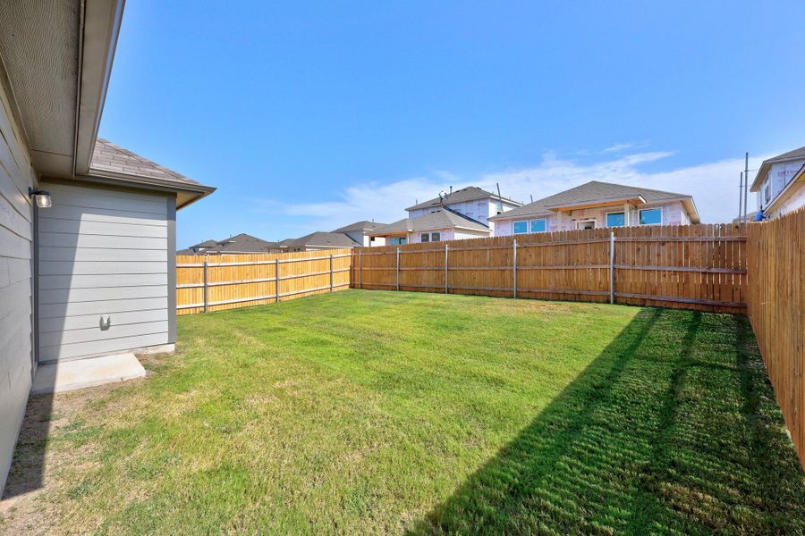 Exterior details and patio area of a home in Trinity Ranch, Elgin (Image 4).