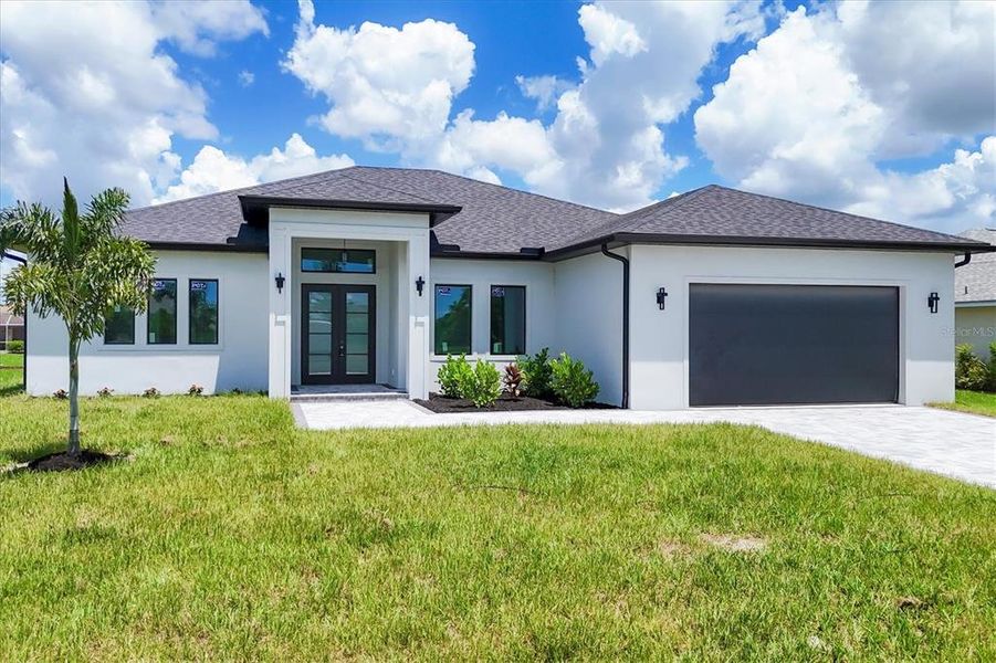 Front exterior of a new home in , Rotonda West, FL, highlighting curb appeal (Image 27). Front exterior of a new home in , Rotonda West, FL, highlighting curb appeal (Image 27).