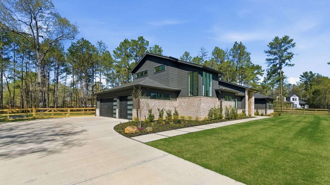 Front exterior of a new home in , Magnolia, TX, highlighting curb appeal (Image 20).