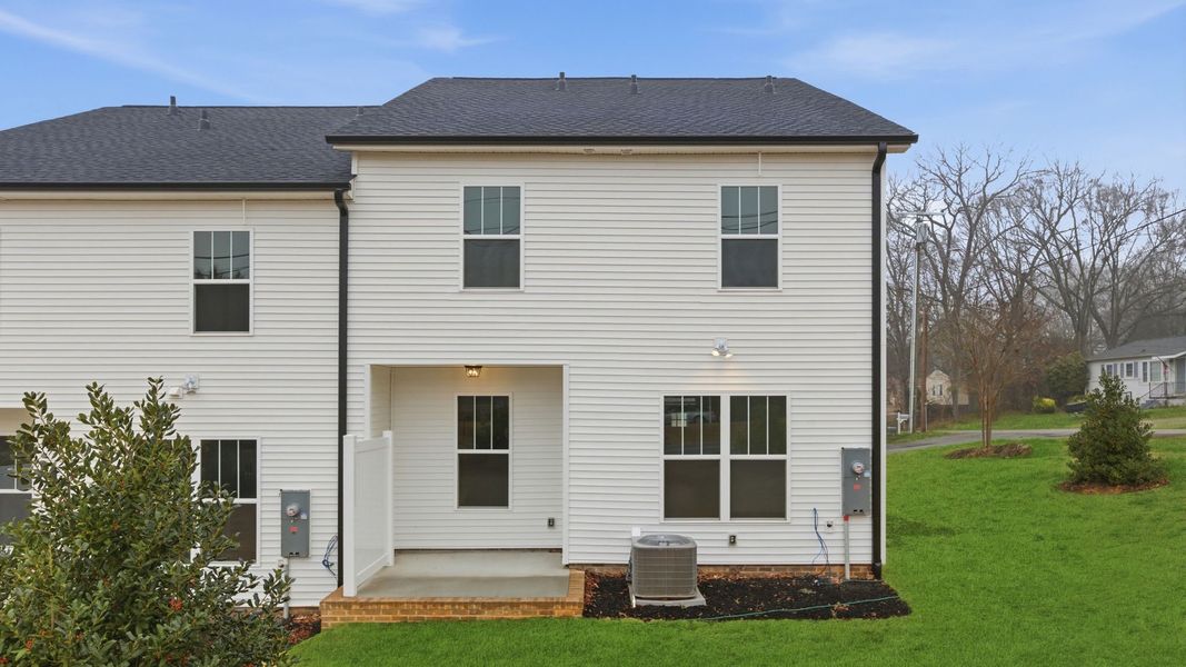 Exterior details and patio area of a home in Pearson Road Townhomes, Easley (Image 3).