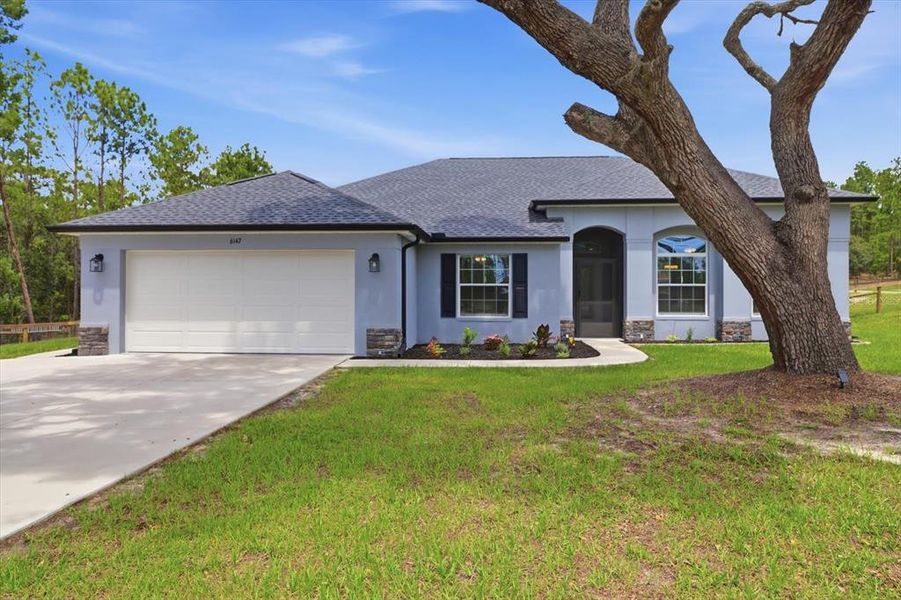 Front exterior of a new home in , Beverly Hills, FL, highlighting curb appeal (Image 24). Front exterior of a new home in , Beverly Hills, FL, highlighting curb appeal (Image 24).