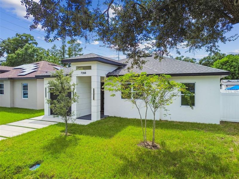 Front exterior of a new home in , Tampa, FL, highlighting curb appeal (Image 36).