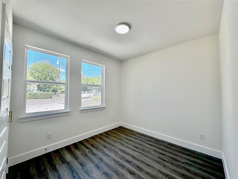 Spare room featuring dark hardwood / wood-style floors