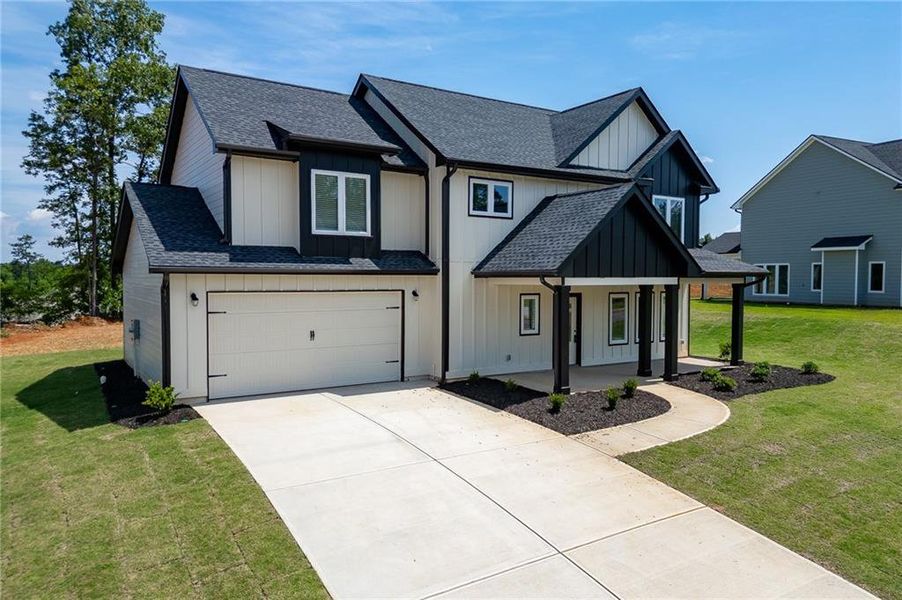 Front exterior of a new home in , Toccoa, GA, highlighting curb appeal (Image 1). Front exterior of a new home in , Toccoa, GA, highlighting curb appeal (Image 1).